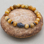 Reichtum und Achtsamkeit Buddha-Armband aus goldenem Tigerauge